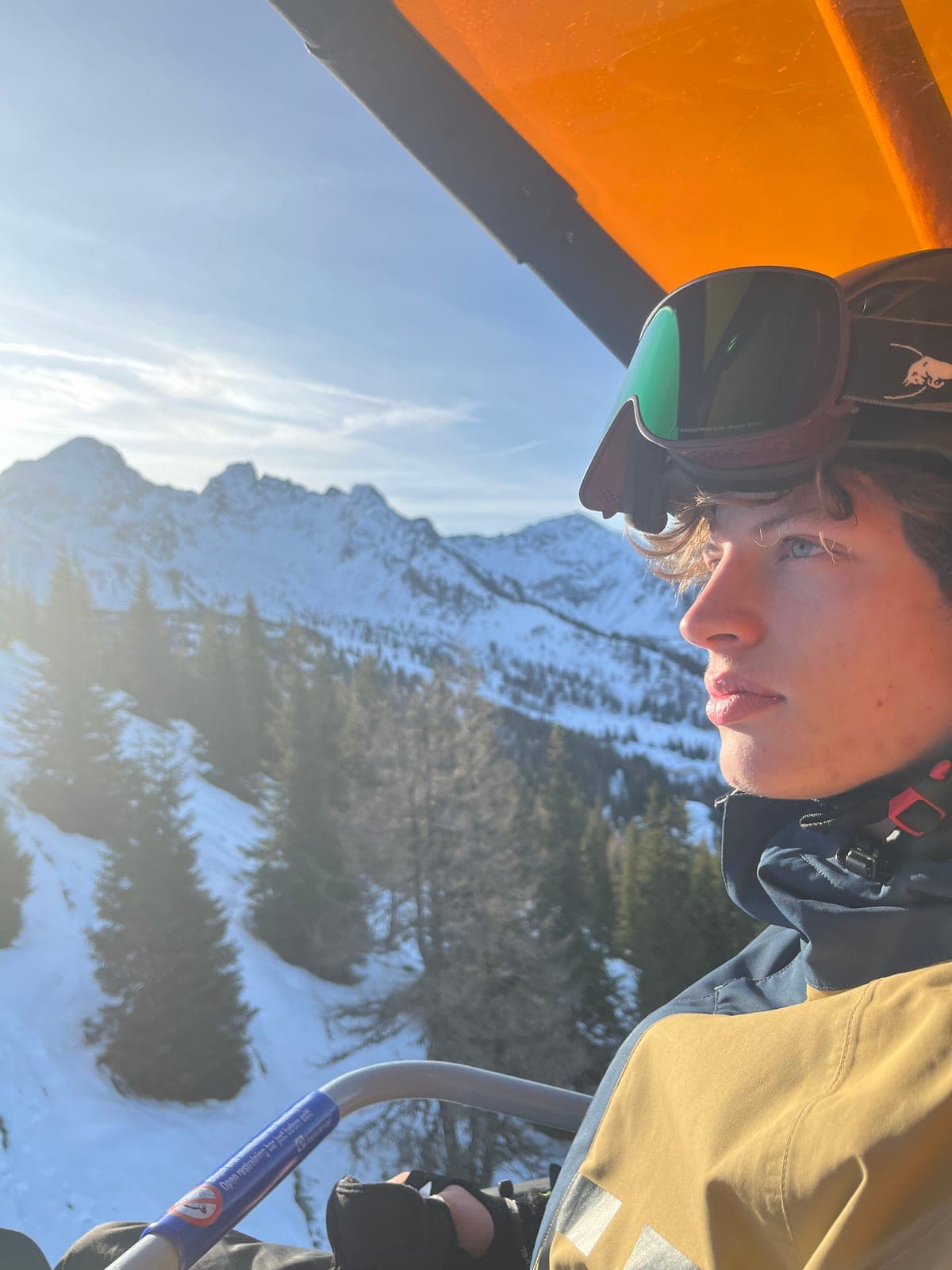 Walking green flag in Prague on a ski lift in snowy mountains